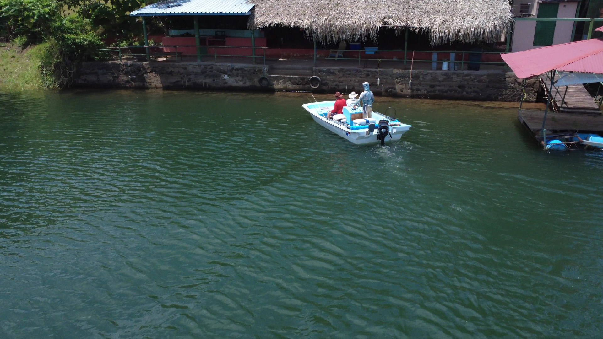 PanalakeSportfishing custom fishing boat running on Gatun Lake, Panama with anglers on board