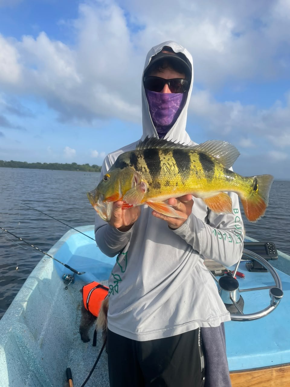Young angler with peacock bass caught with Panalake Sport Fishing, Panama