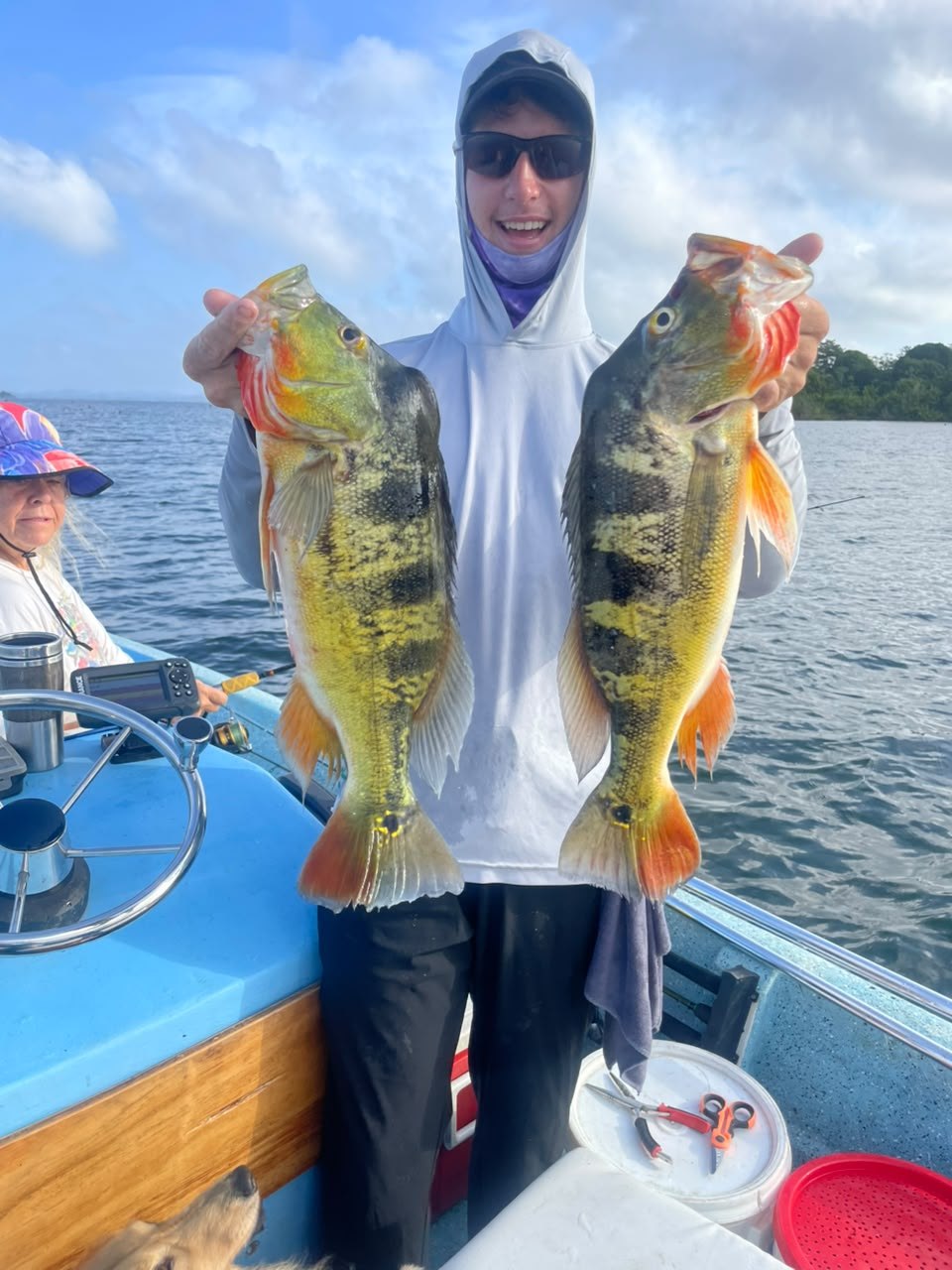 Angler with peacock bass on Panalake fishing charter, Gatun Lake Panama